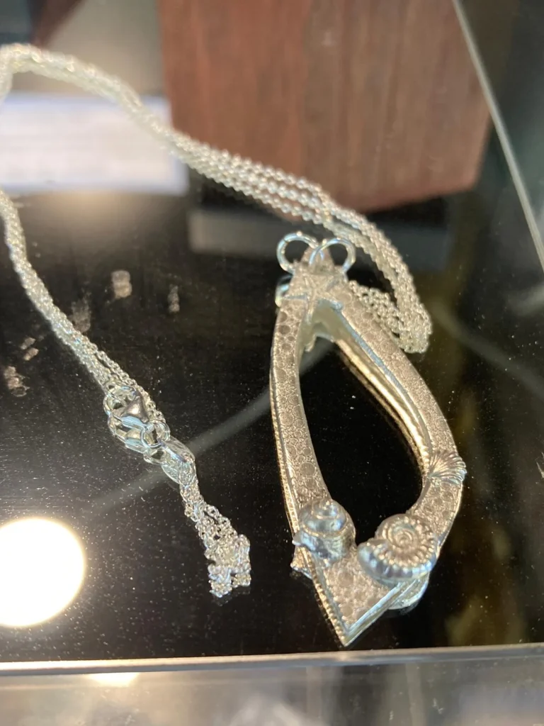 A silver native pendant